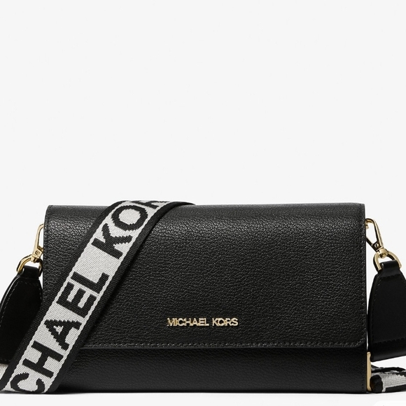 Michael Kors Handbags - Chic black crossbody with gold accents and bold logo strap.
Perfect for everyday